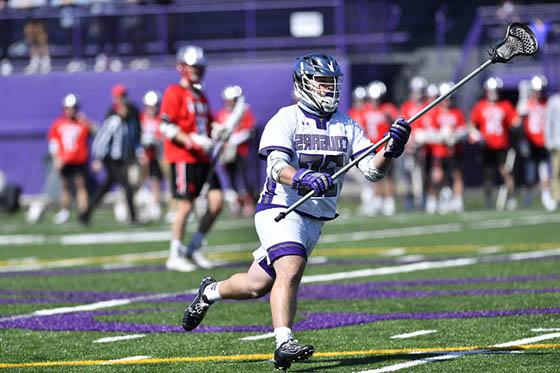 Photo of a Chatham University student athlete playing lacrosse